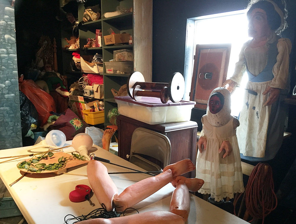 Bits of bodies and old puppets fill most of the space in the workshop.