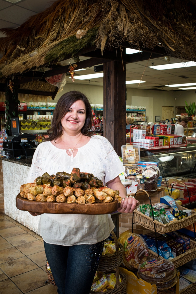 Joana Todica holds a tray of traditional cabbage rolls.