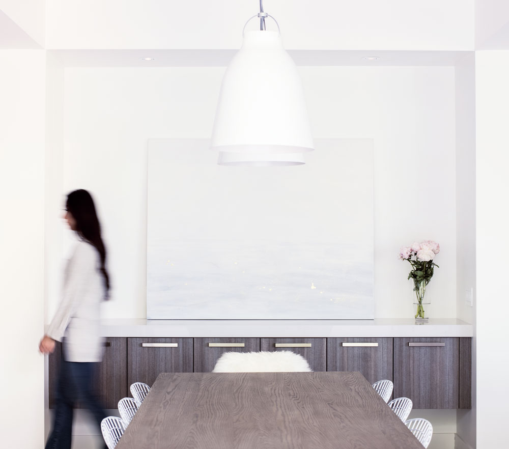 The heart of her home, Angela Cheung’s dining area contrasts metals with warm woods and cool marble while still maintaining a bold, minimal aesthetic.