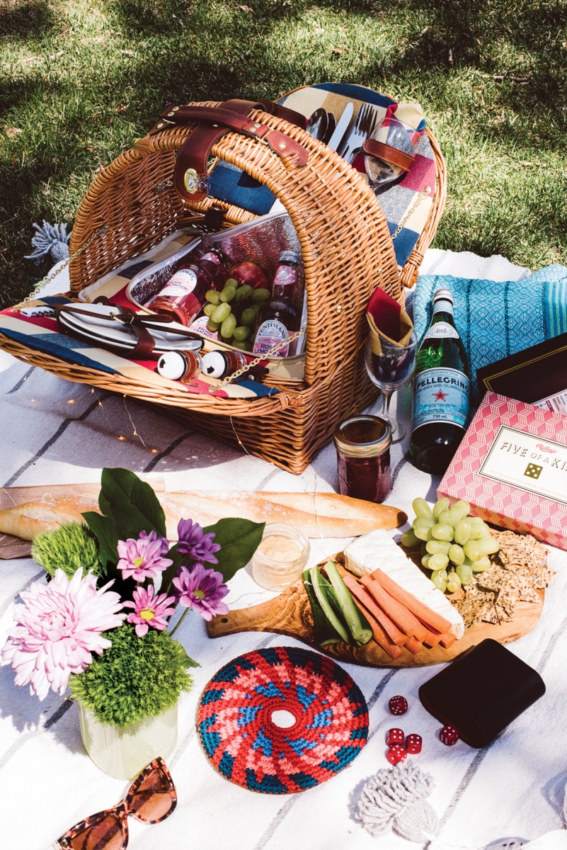 Oak & Olive Athertyn two-person basket, 40; blue blanket, imported from Nicaragua, 2; Ridley's Five-of-a-Kind game, 5; Pocket Disc crochet frisbee, 4 to 0; DecoLite Starry string lights, 1 to 3.50; Bohemia Cotton Pom Pom white blanket, 45; all from 28 Blankets.