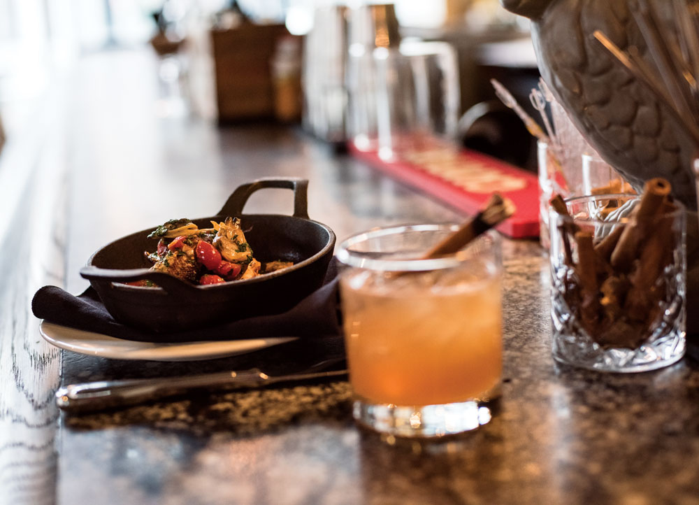 Pan-braised smelt with sofrito and clam vinaigrette paired with The Wallace cocktail at Proof.