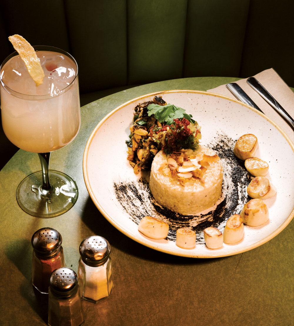 The Coup’s green-tea smoked and seared king oyster mushroom “scallops” served on black sesame paste with a side of coconut pandan rice and Thai eggplant peanut salad.