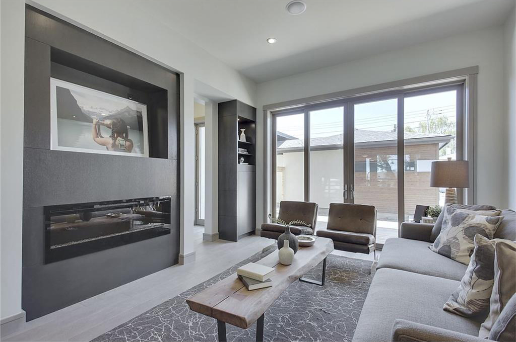 The living room has triple-glazed Kolbe glass doors that help regulate the internal temperature of the home.