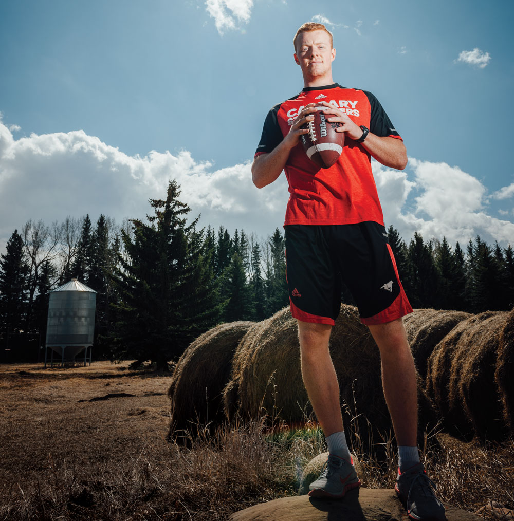 Football player Andrew Buckley at his family farm near Springbank.