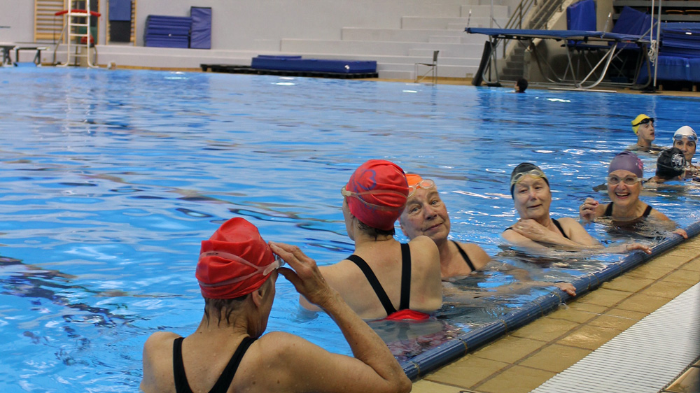 Before training gets started, the ladies chat, catch up and swim a few laps of the Talisman Centre's dive tank to warm up.