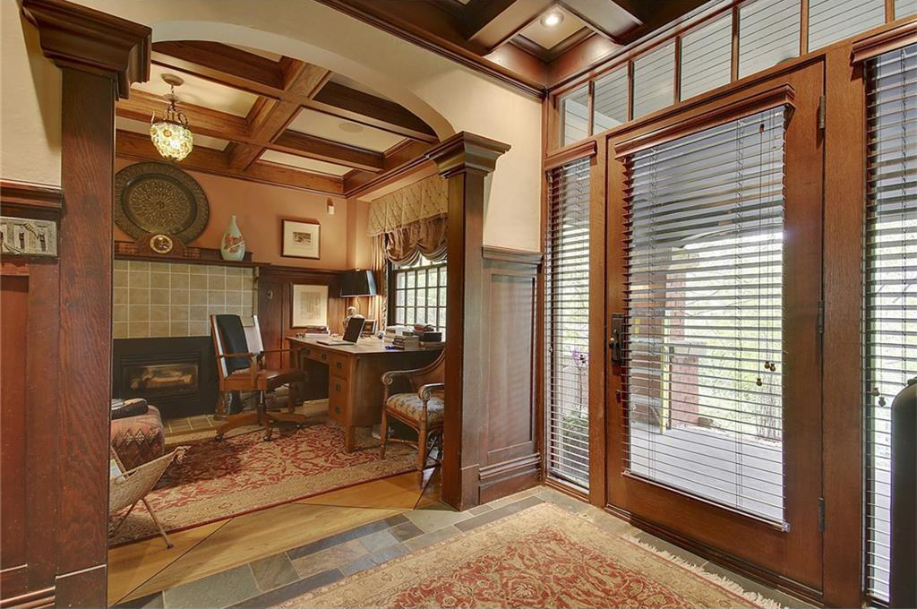 An office, with an original fireplace, sits directly off the large front porch and entryway.